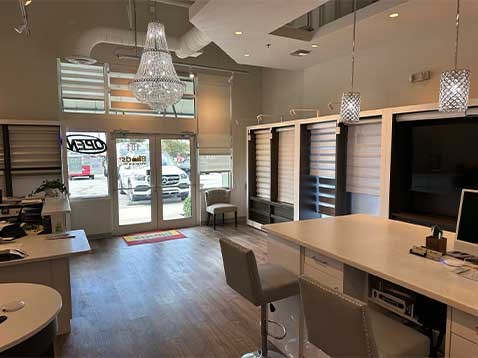 Store interior showcasing several different types of window coverings